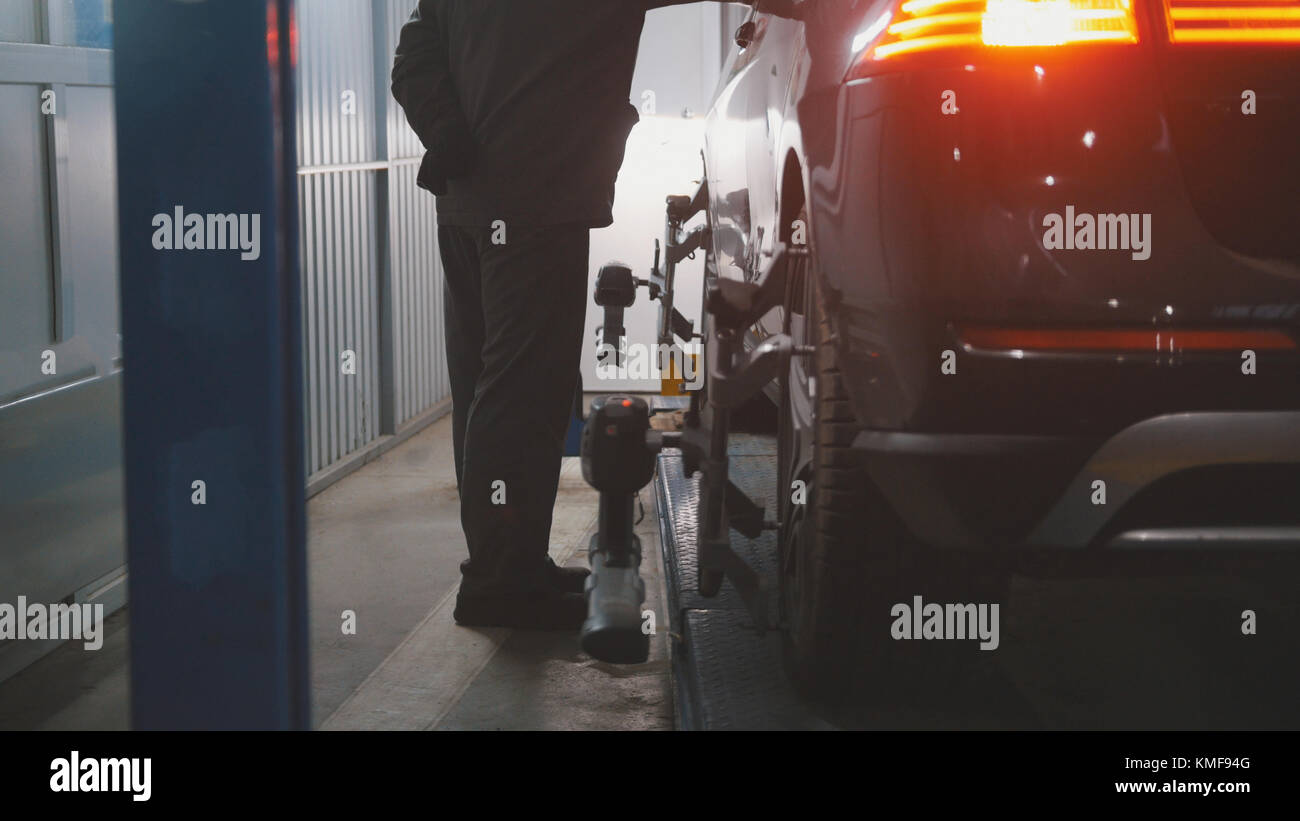 Car in auto work shop service lifting for repairing Stock Photo - Alamy