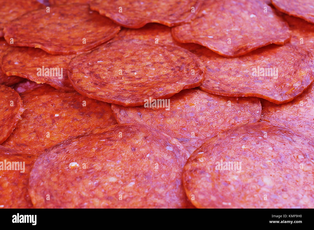 Texture with cut salami design. Sliced salami sausage pattern. Snags