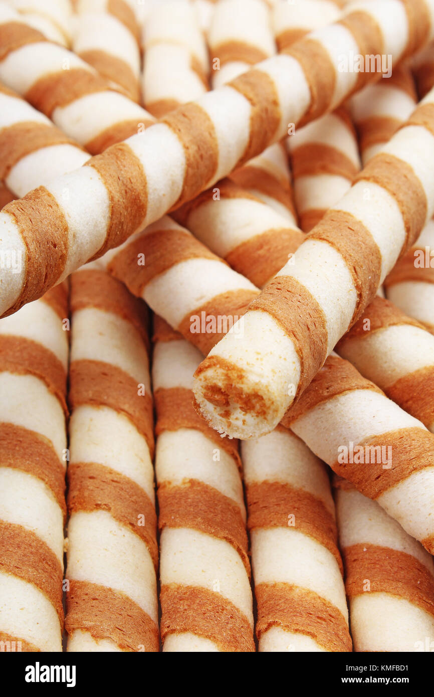 Ice cream wafer sticks as background. Wafer biscuit swirled stick