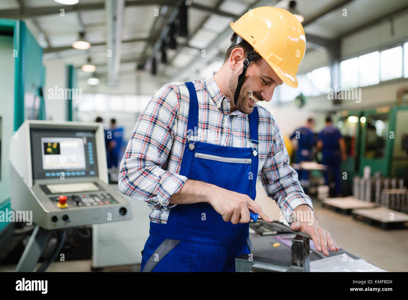industrial factory employee working in metal manufacturing industry Stock Photo