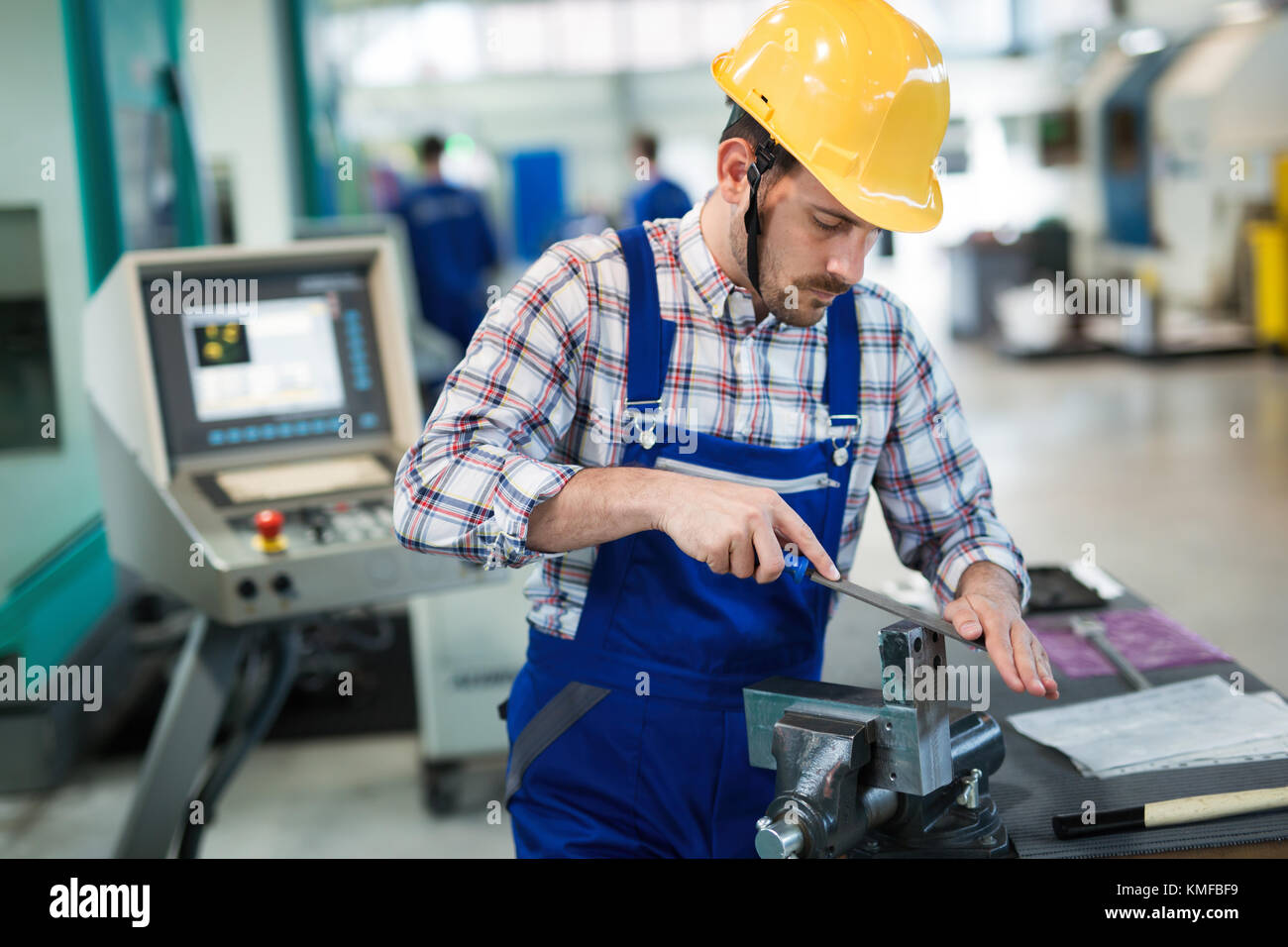 Metal industry factory worker working on metal parts Stock Photo Alamy
