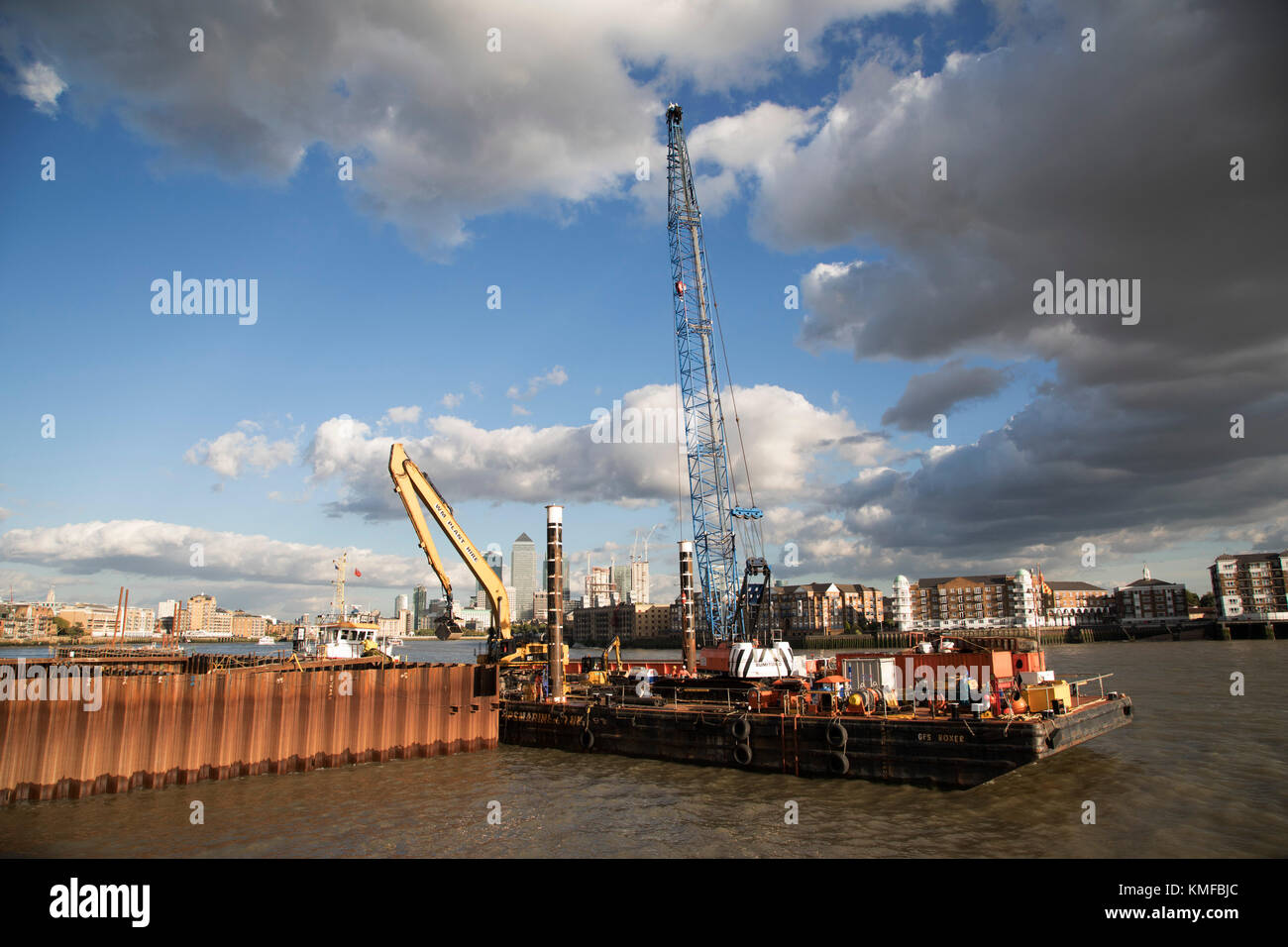 Construction work underway on the Thames Tideway Tunnel or Super Sewer on the River Thames near Wapping in London, England, United Kingdom. The Thames Tideway Tunnel is an under-construction civil engineering project 25 km tunnel running mostly under the tidal section of the River Thames through central London, which will provide capture, storage and conveyance of almost all the combined raw sewage and rainwater discharges that currently overflow into the river. Stock Photo