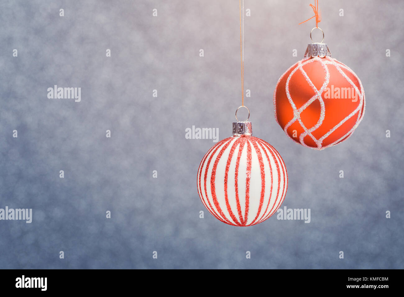 Photo of red Christmas tree with pattern of balls on gray blurred ...