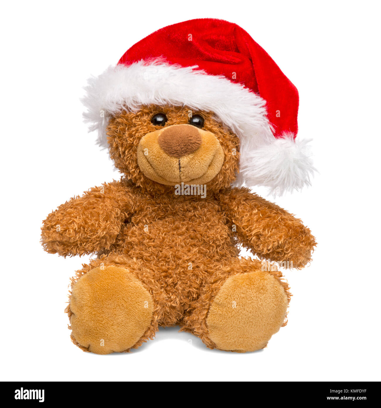 Christmas teddy bear wearing a Santa Claus hat isolated on white background, cut out. Stock Photo