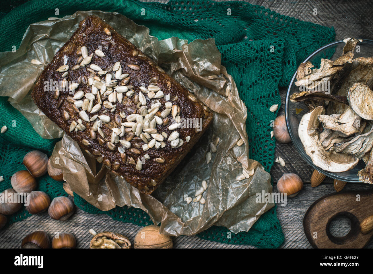 Closeup of bread with seeds, nuts and mushrooms in rustic style Stock Photo