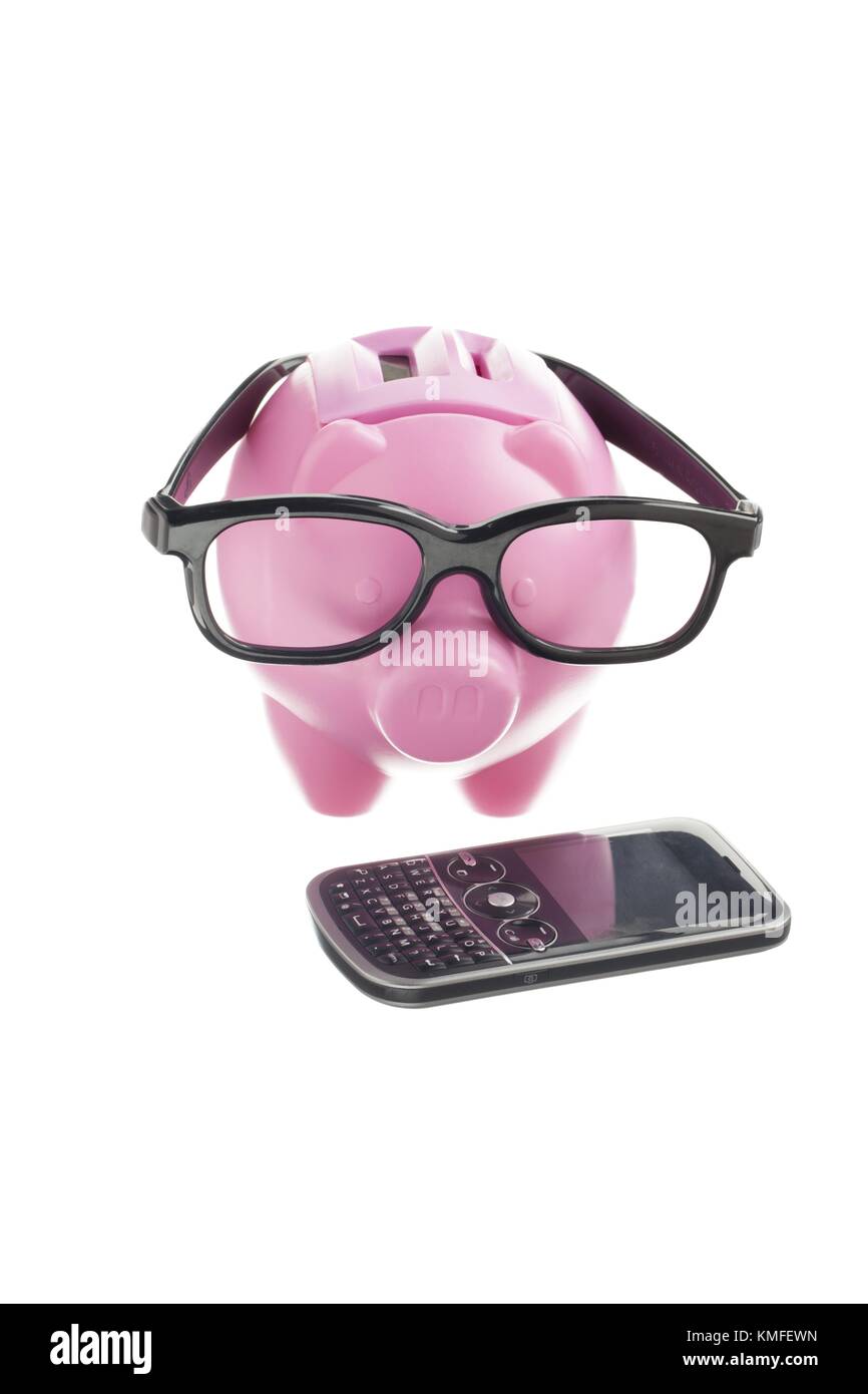 pink piggy bank with eye glasses with cellphone Stock Photo - Alamy