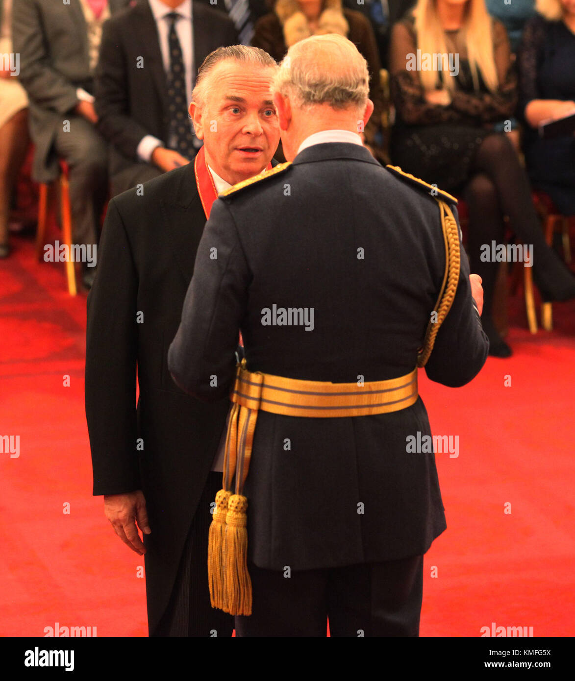 Sir Mark Elder from London is made a Companion of Honour by the Prince of Wales during an