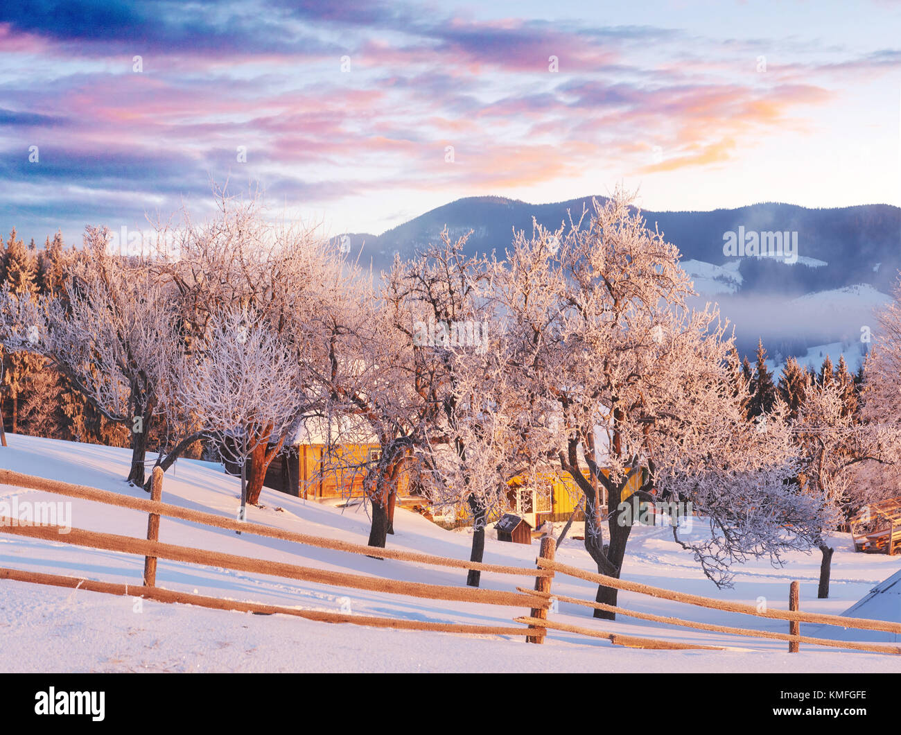 Amazing mountains in the morning sunlight. Small cozy village ...