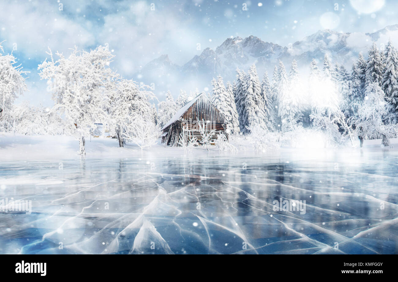 Blue ice and cracks on the surface of the ice. Frozen lake in winter ...