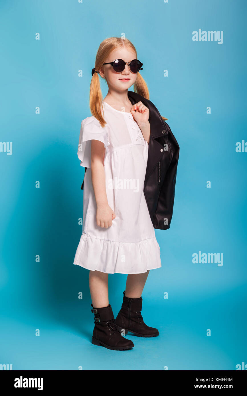 a little girl in the white dress and black shoes Stock Photo - Alamy