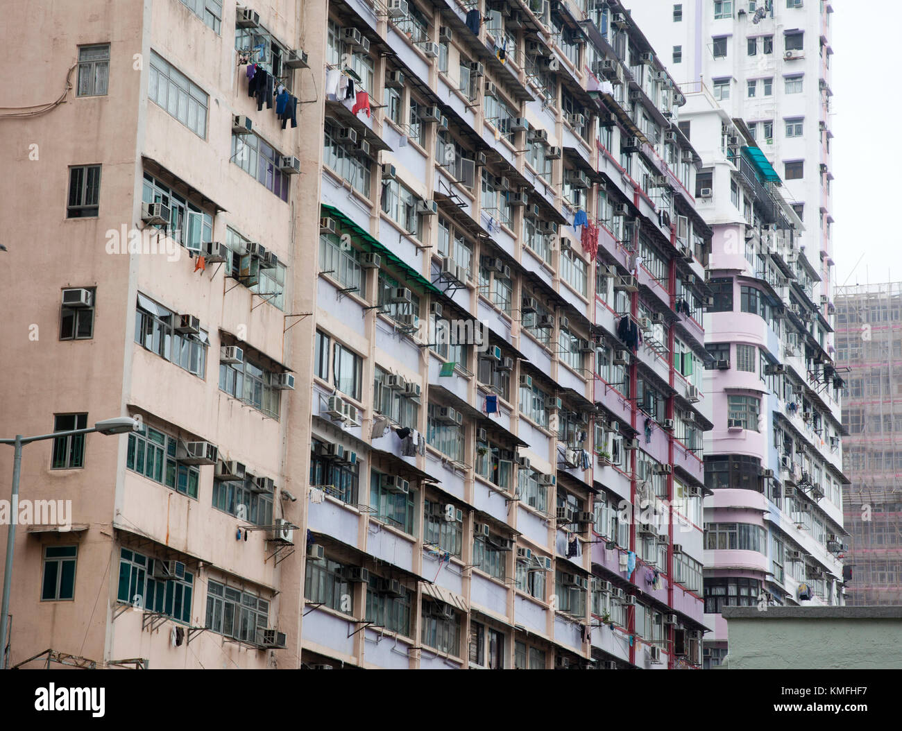 in Kowloon, Hong Kong, laundry hangs outside a dingy apartment Stock