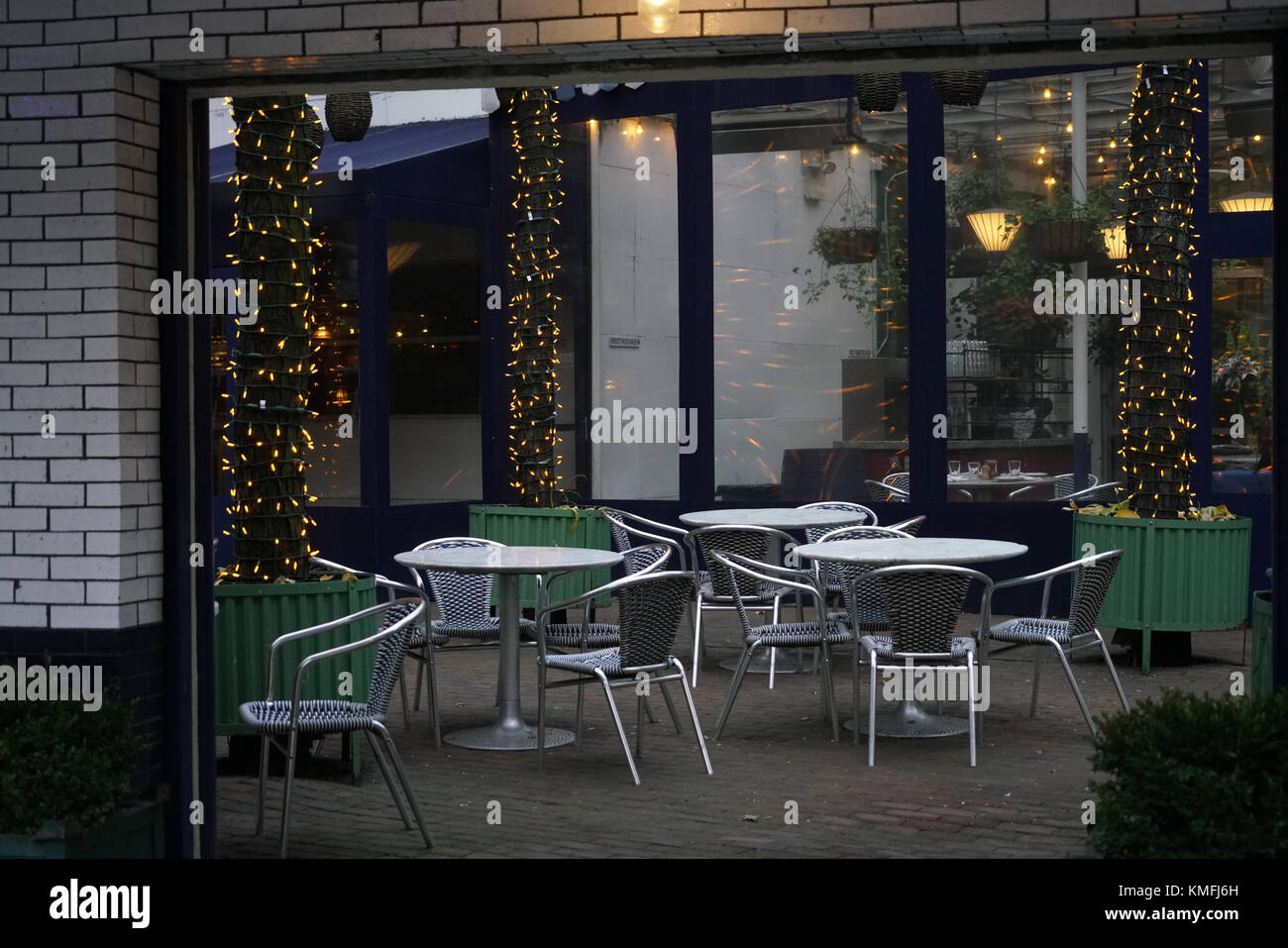 empty sidewalk cafe with Christmas lights. NoHo. Manhattan.New York City.USA Stock Photo