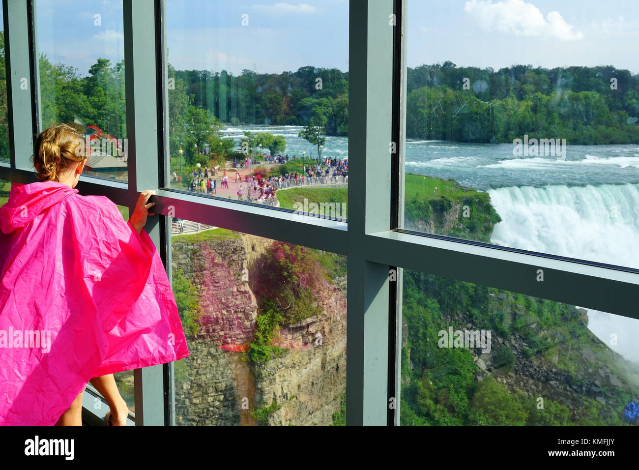 Young girl looking at the Niagara Falls from the Observation Tower, Niagara Falls, New York, USA Stock Photo