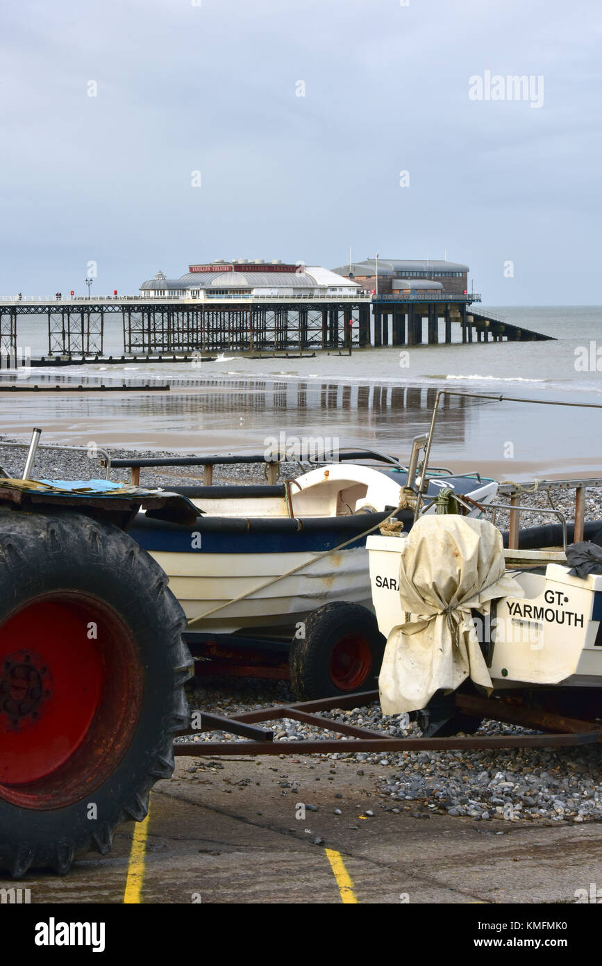 cromer pier in Norfolk with crab fishing boats and launching tractors
