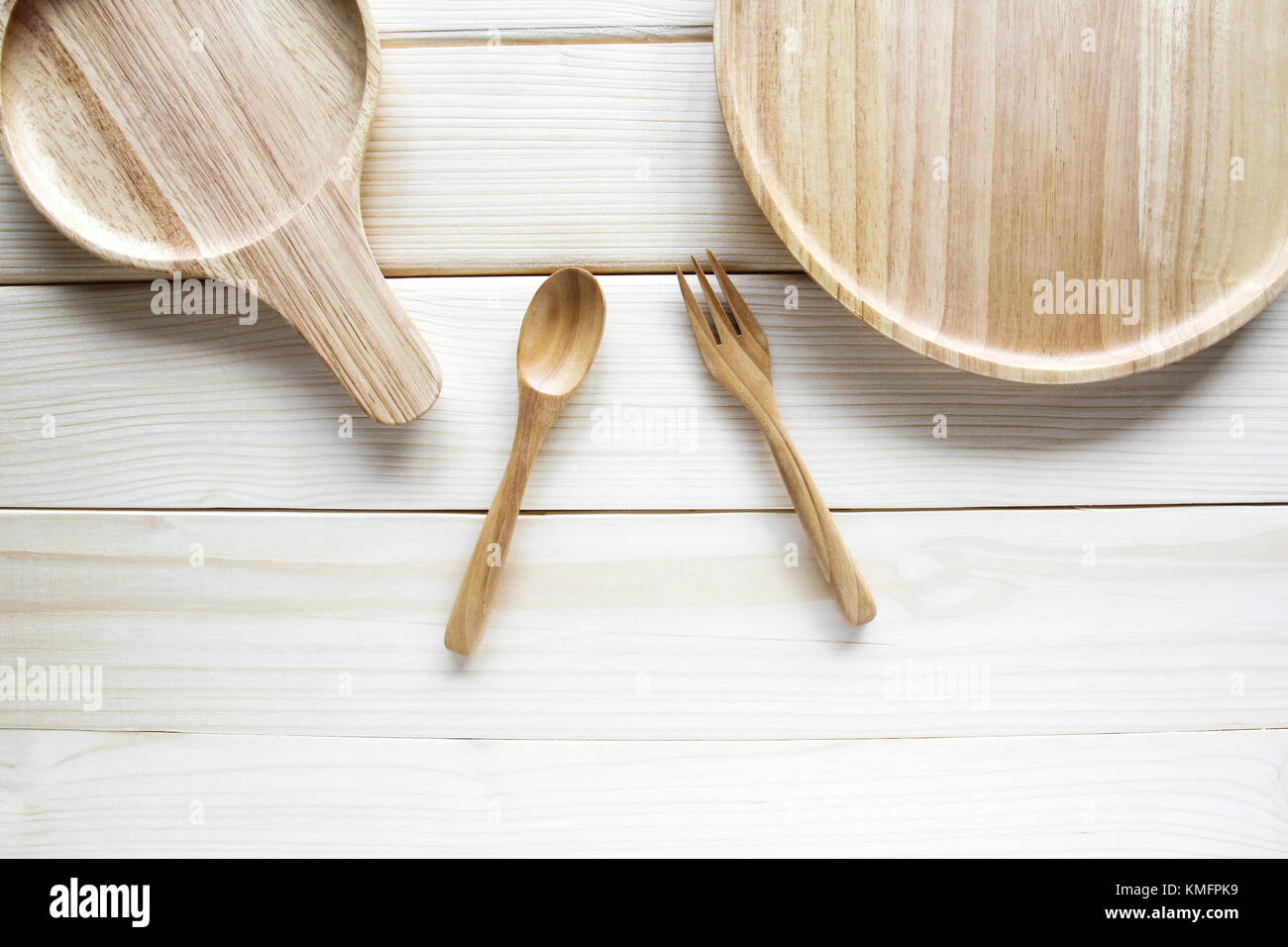 Wooden kitchen utensils on wooden background Stock Photo - Alamy