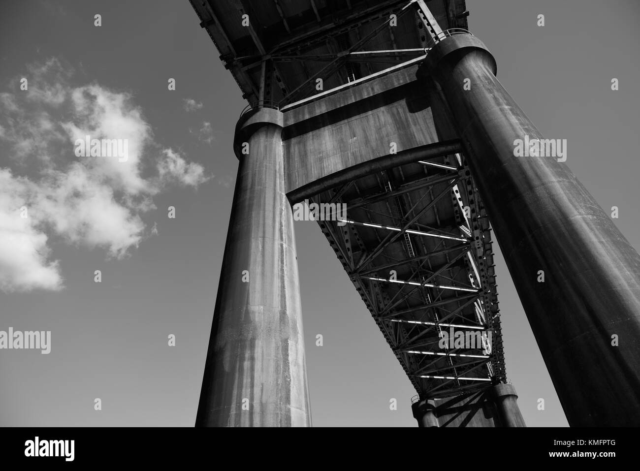 Huge pillars supporting the Vintage Calcasieu River World War II Memorial Bridge connecting Lake Charles and Westlake, Louisiana Stock Photo