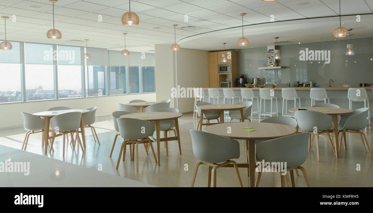 Tables and chairs in modern office cafeteria Stock Photo
