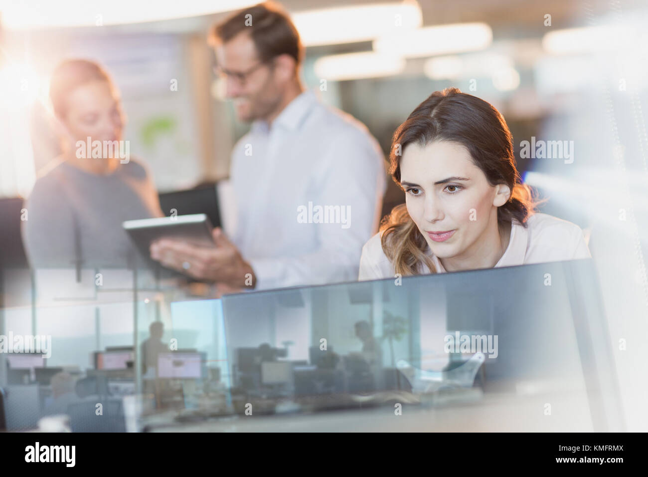 Businesswoman using computer in office Stock Photo - Alamy