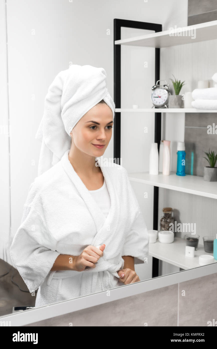 Woman tying bathrobe belt Stock Photo Alamy