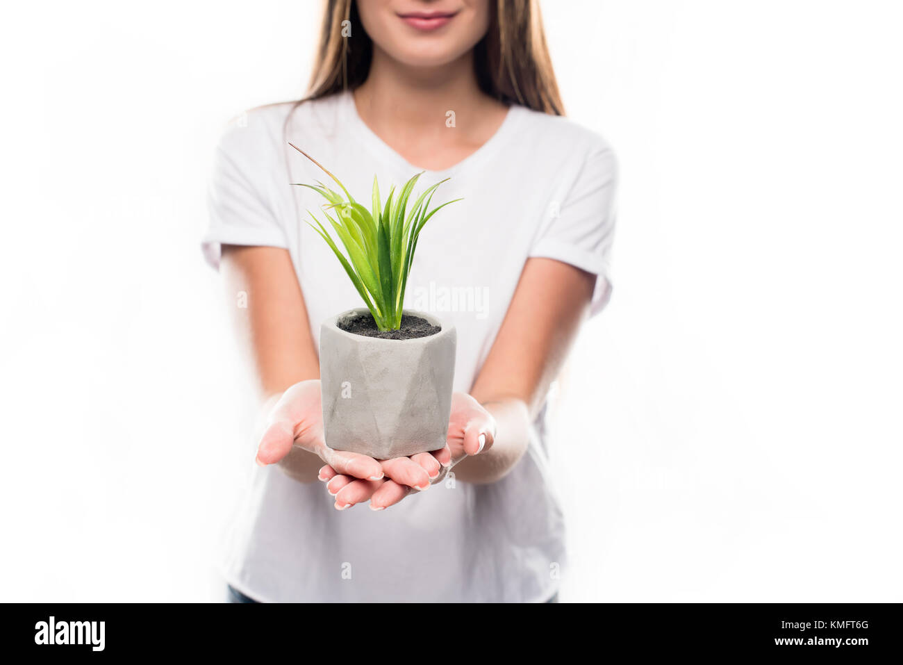 girl holding potted plant Stock Photo - Alamy