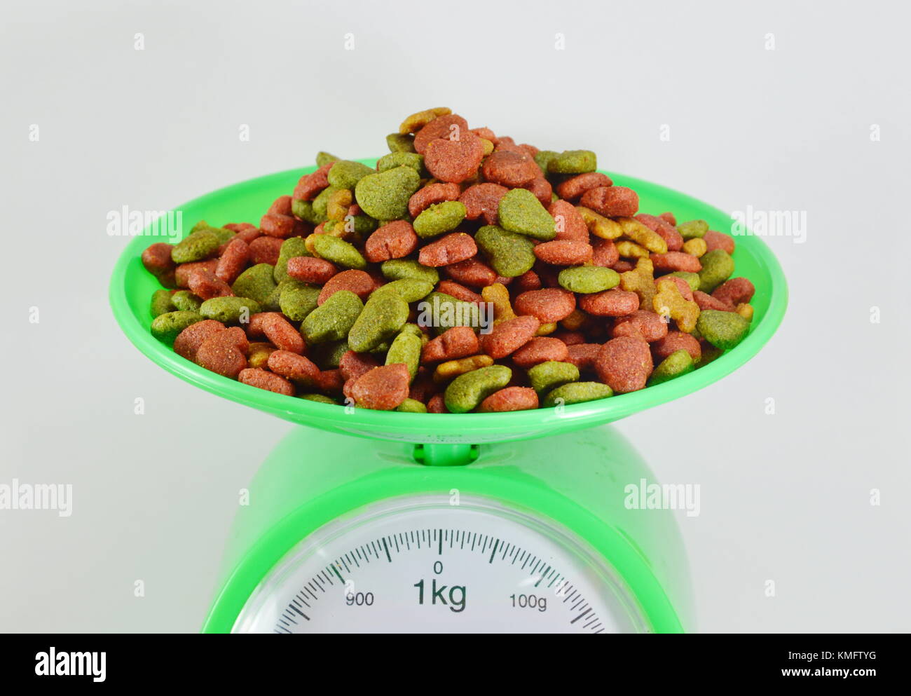 pet food on green weighting scale Stock Photo Alamy