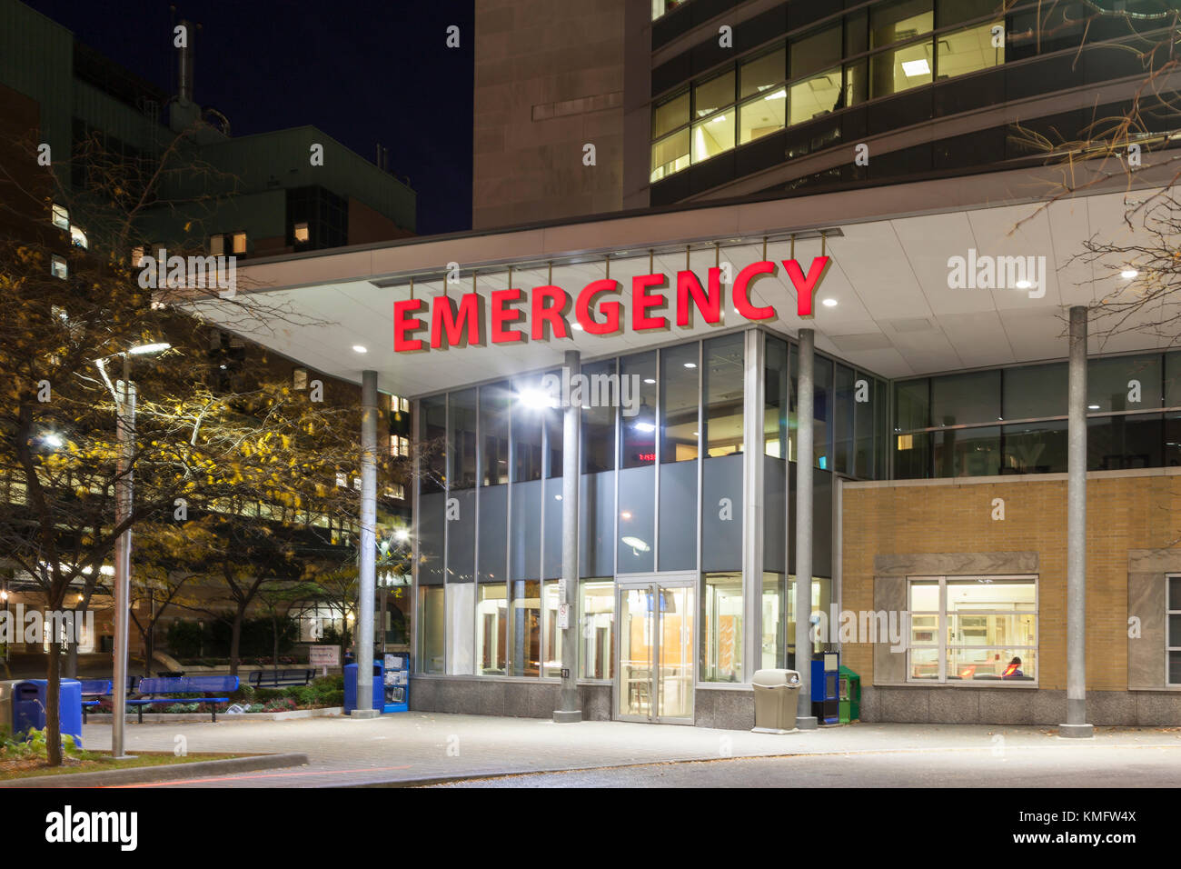 Emergency entrance at a modern hospital illuminated at night Stock Photo