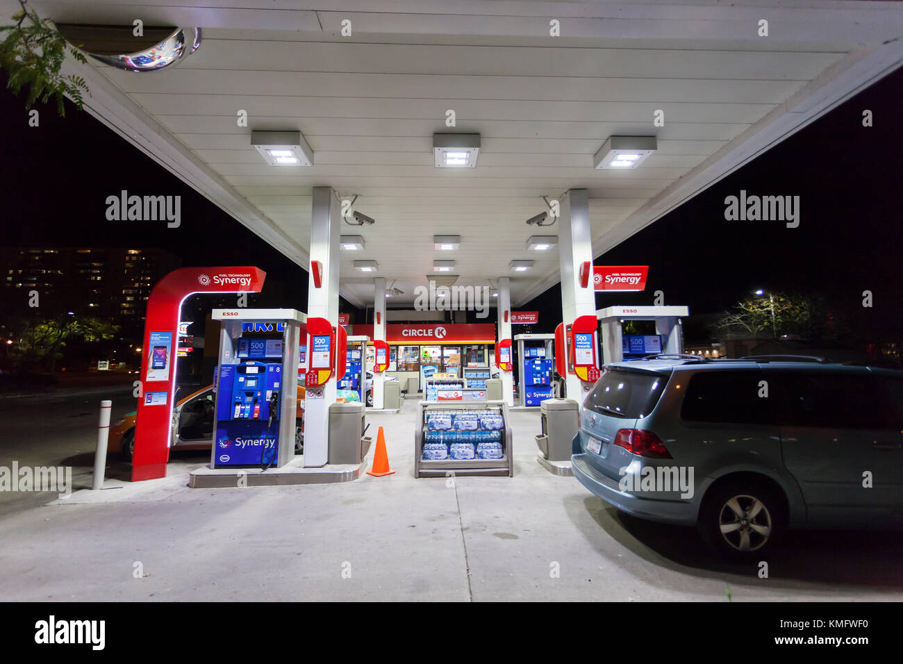 Toronto, Canada - Oct 19, 2017: Fuel pumps at an Esso gas station at night Stock Photo