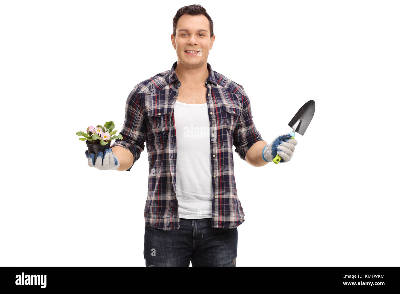 Gardener holding a flower in a pot and a spade isolated on white background Stock Photo