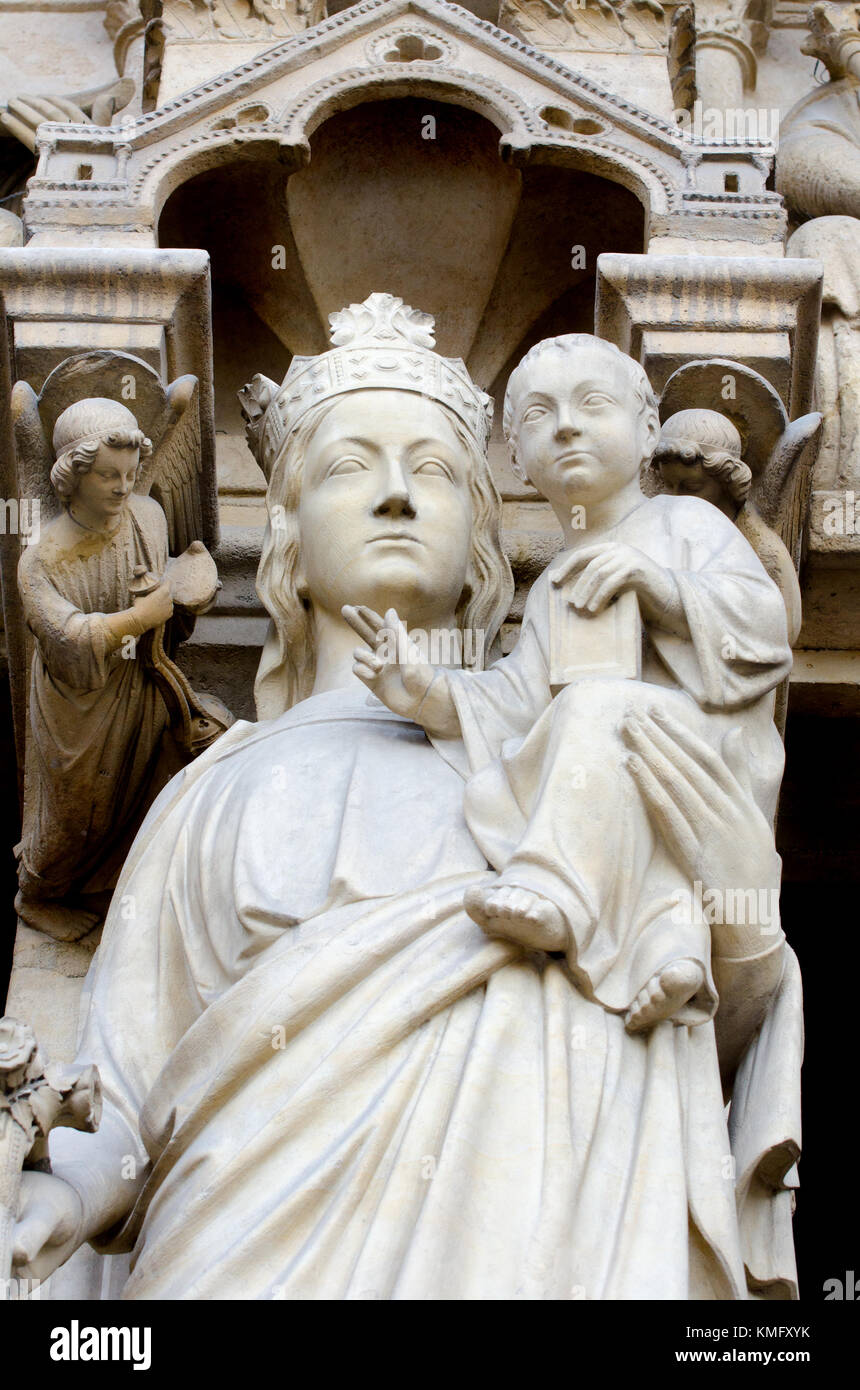 Paris, France. Notre Dame cathedral / Notre-Dame de Paris on Isle de la Cite. Gothic. Facade detail. Madonna and Child, in the Potal of the Virgin Stock Photo