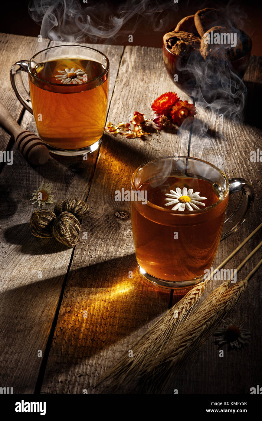 Cups with hot tea on a wooden table, rustic Stock Photo - Alamy