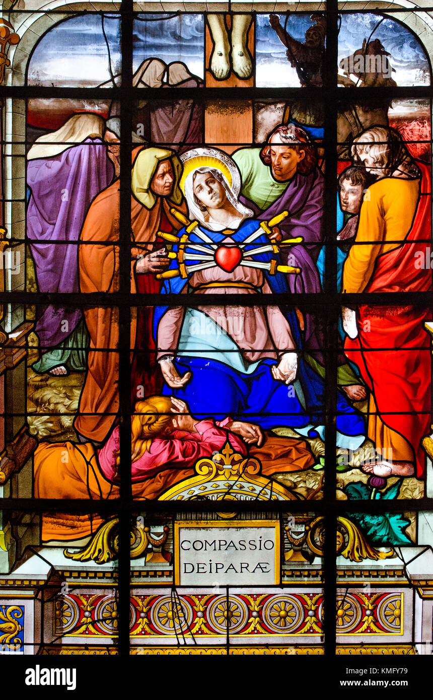 Paris, France. Notre Dame cathedral / Notre-Dame de Paris on Isle de la Cite. Stained glass window in the chapel of Notre Dame des malades: compassion Stock Photo