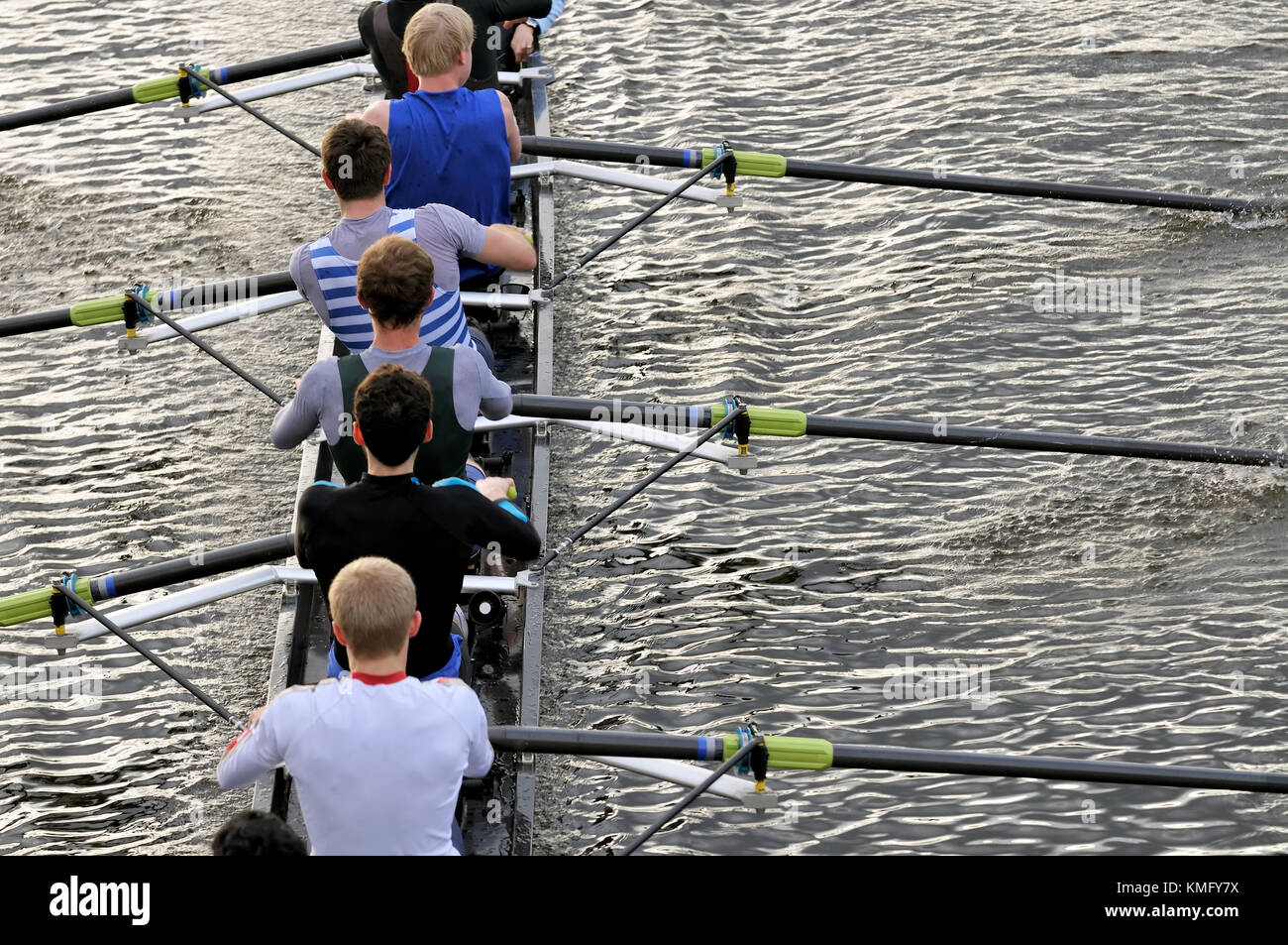 Rowing team closeup. Detail of men's eight pulling together on sweep