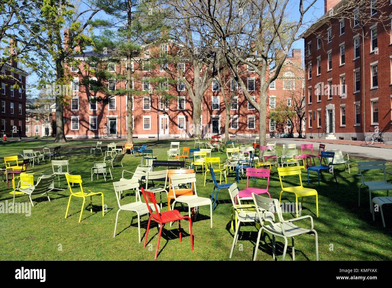 Colorful chairs in Harvard University campus adding a touch of fun and a welcoming spirit to the historic Old Yard. Stock Photo