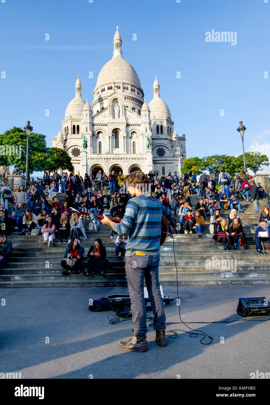 Paris, France. Montmartre. Busker playing to crowds on the steps up to the Sacre Coeur Stock Photo