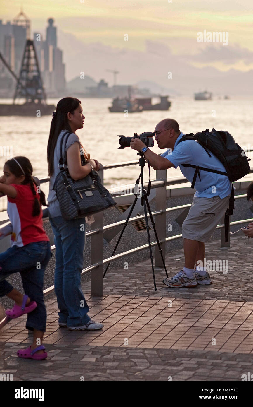 Photographer and tourists, Hong Kong island, SAR, China Stock Photo