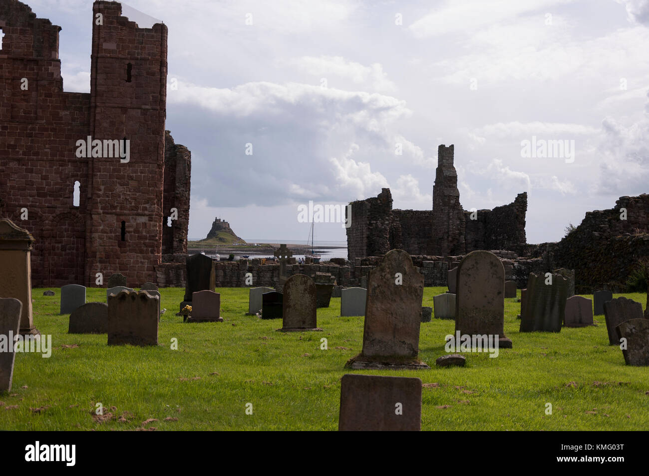 Looking to Lindisfarne castle from Lindisfarne priory, at Holy Island in Northumberland on the North East coast of England. Stock Photo