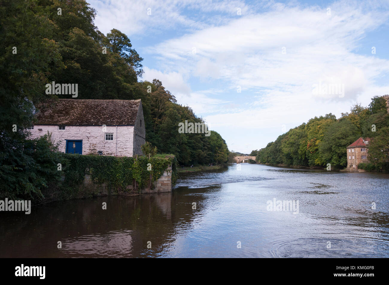 White stone Mill House sitting next to the river Wear with the old Fulling Mill further downbridg, in the City of Durham in the North East Of England. Stock Photo