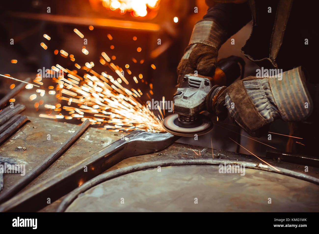 worker sawing metal with a saw, sparks fly Stock Photo Alamy