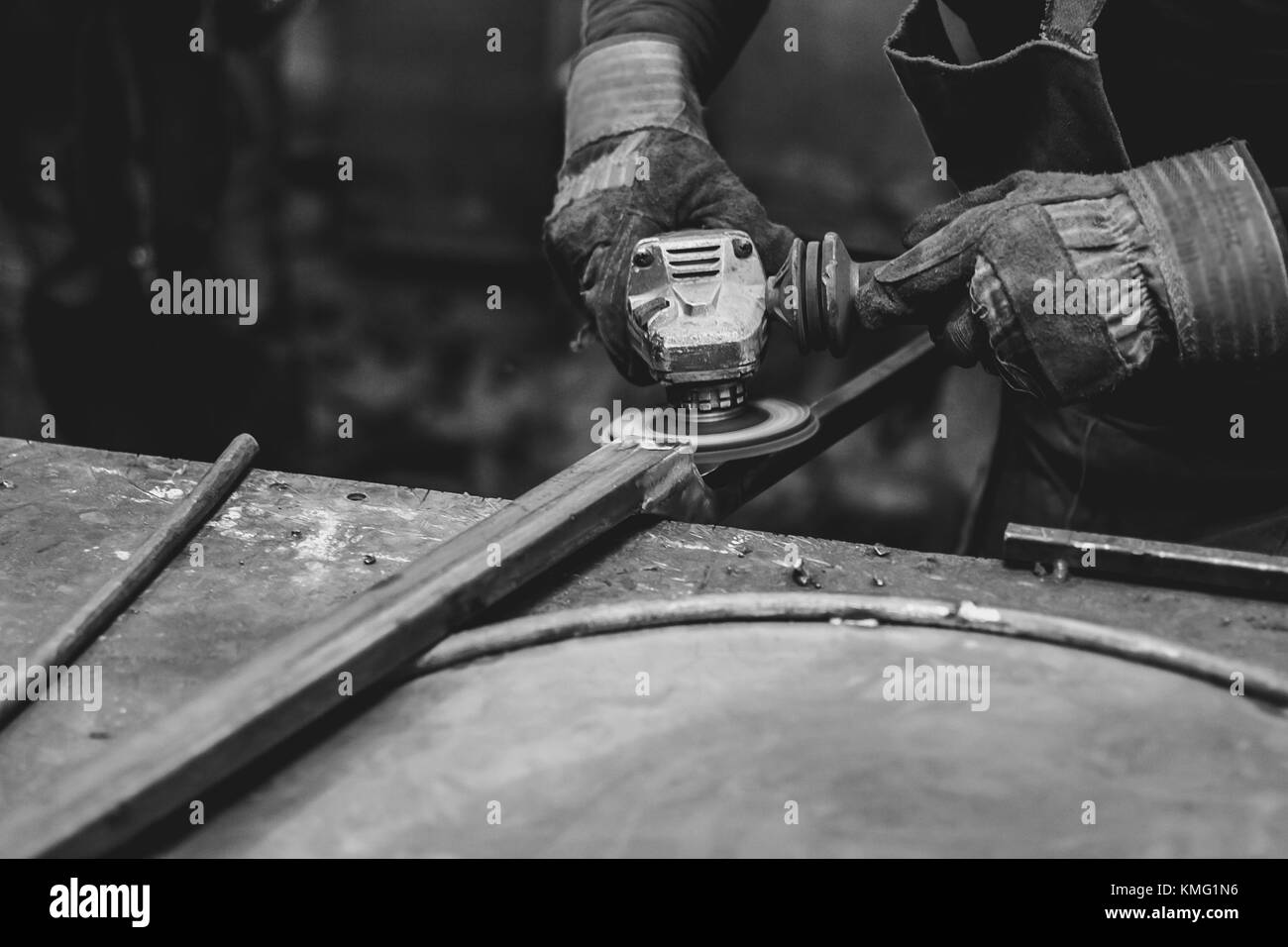 worker sawing metal with a saw, sparks fly Stock Photo Alamy
