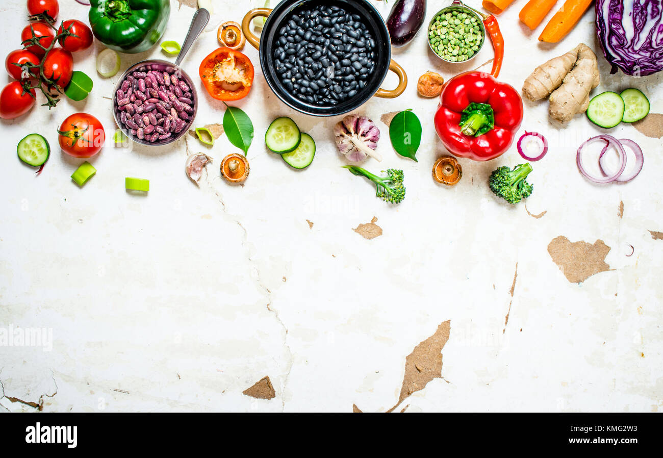 Healthy organic food. Fresh raw vegetables with beans and lentils. On ...