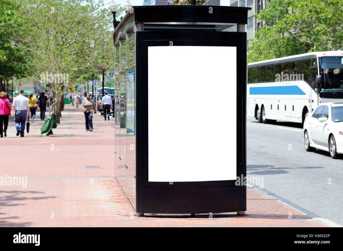 Bus shelter advertising. Blank billboard on brick sidewalk, people and traffic on the background Stock Photo