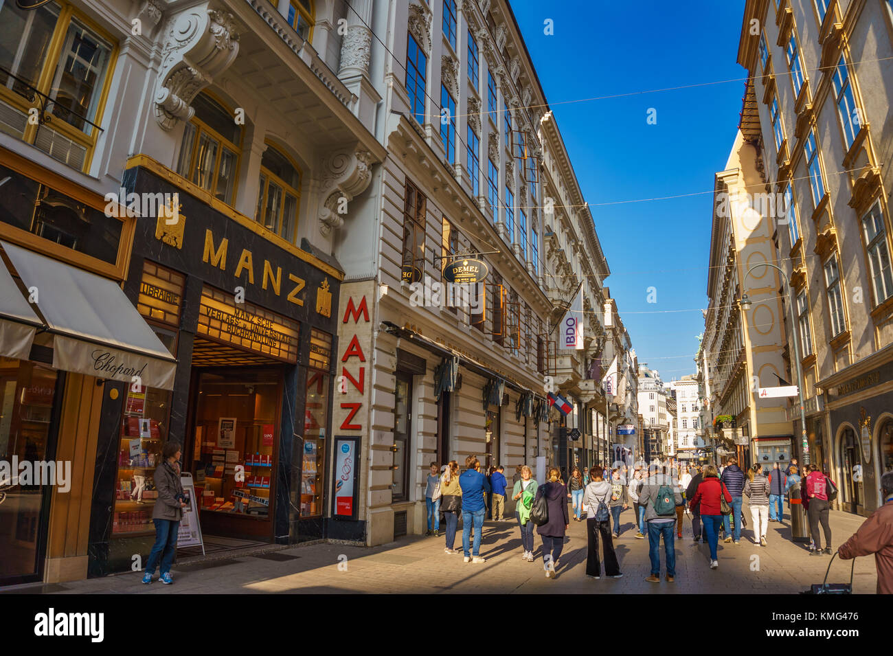 Walking by the crowded streets in the city center of Vienna, Austria. Colorful stores, shops and restaurants at Grabenstrasse. Vienna, Austria, Europe Stock Photo