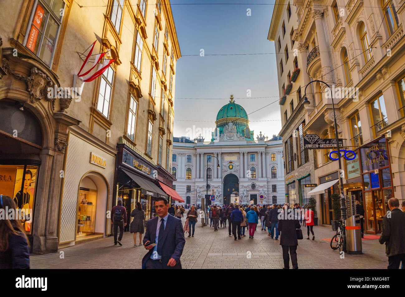 Walking by the crowded streets in the city center of Vienna, Austria. Colorful stores, shops and restaurants at Grabenstrasse. Vienna, Austria, Europe Stock Photo