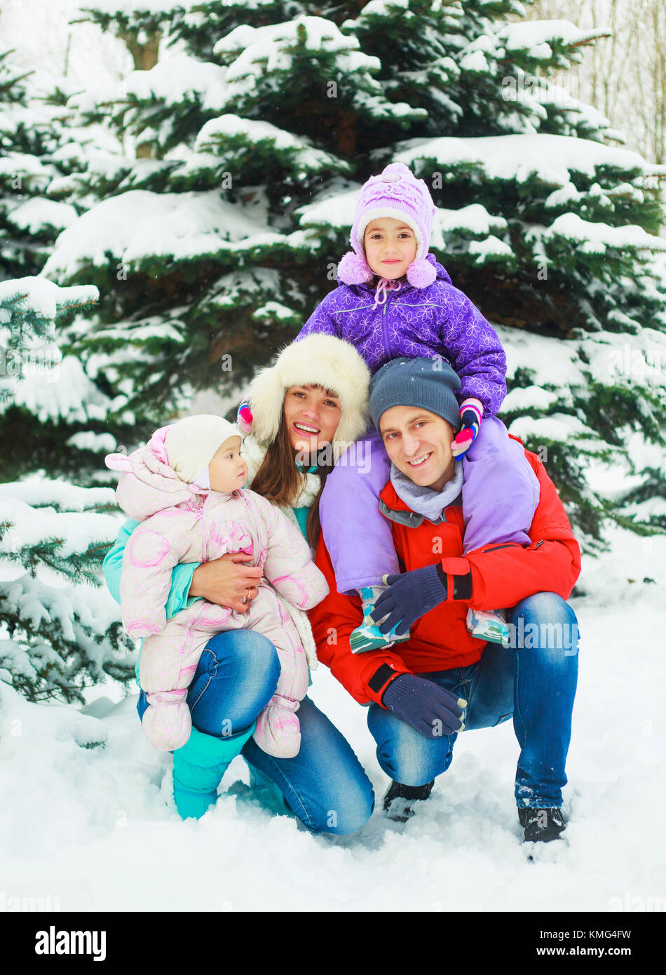 happy family with two kids outdoor in the winter park Stock Photo - Alamy