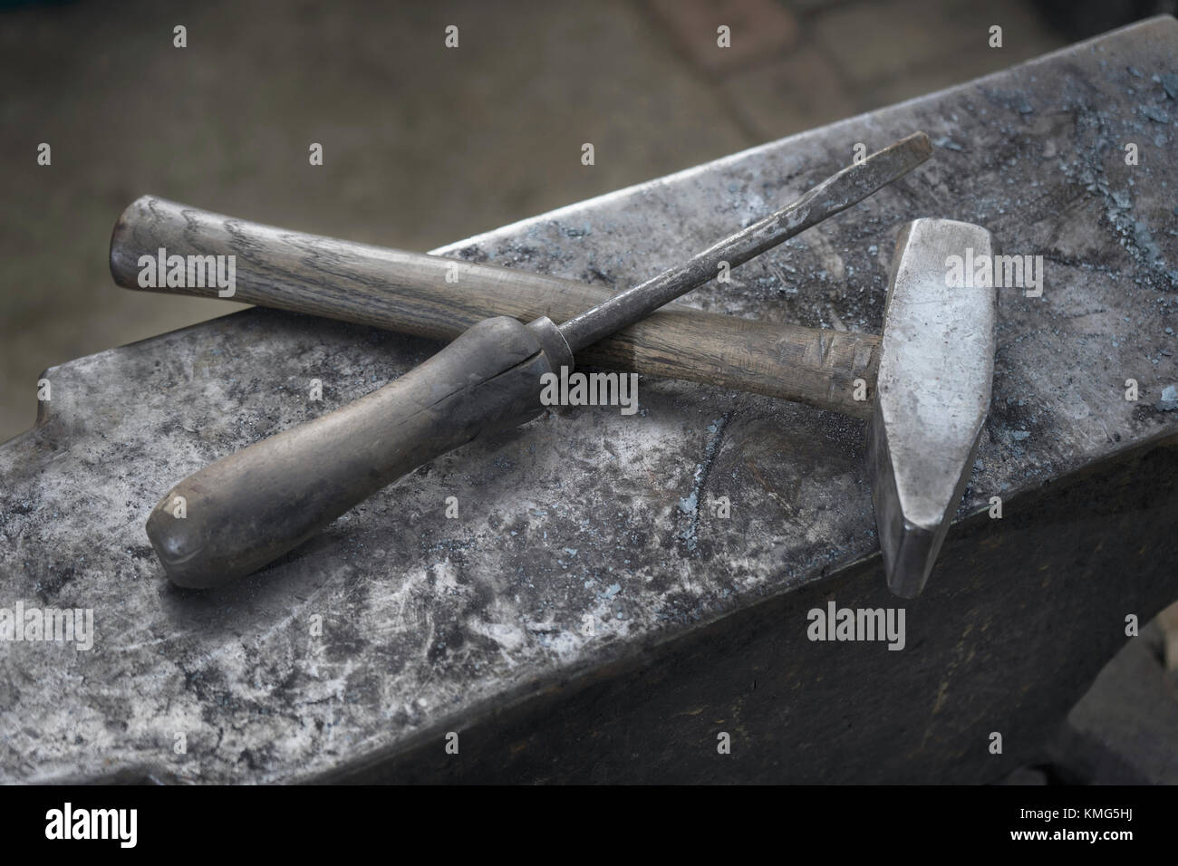 Hammer and screwdriver on anvil at blacksmith shop Stock Photo
