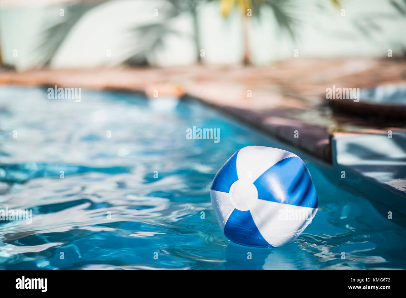 Inflatable ball drifting in swimming pool Stock Photo