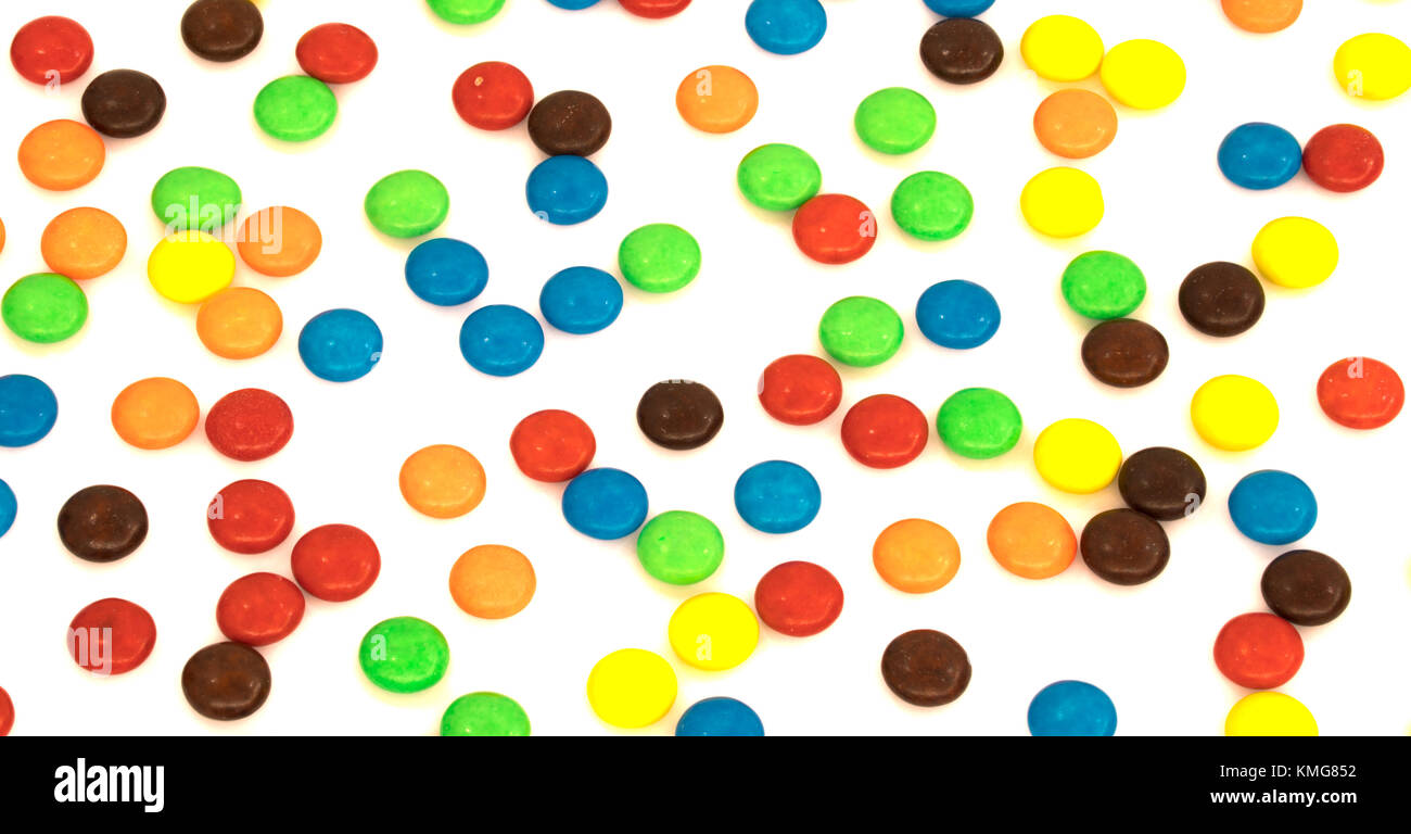 colorful button shaped chocolates candy isolated on white background