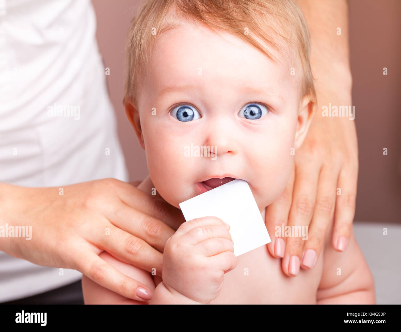 Seven month baby girl's shoulder joints being manipulated by an