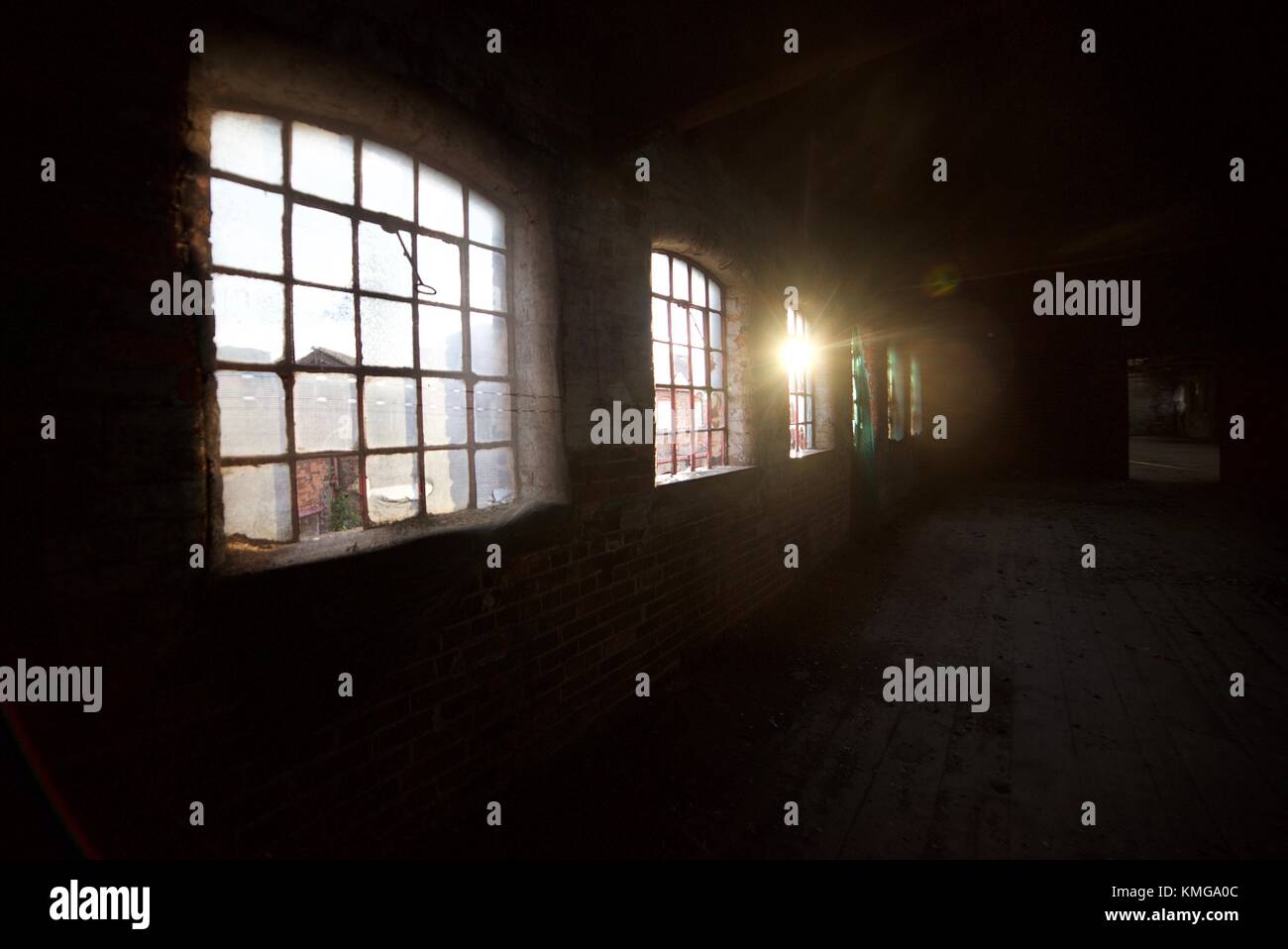 Sun shining through the windows of an abandoned building Stock Photo ...