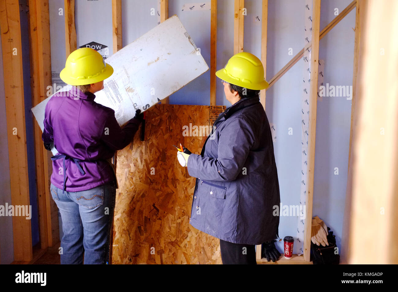 Two women working on a building site in Ontario, Canada. Stock Photo